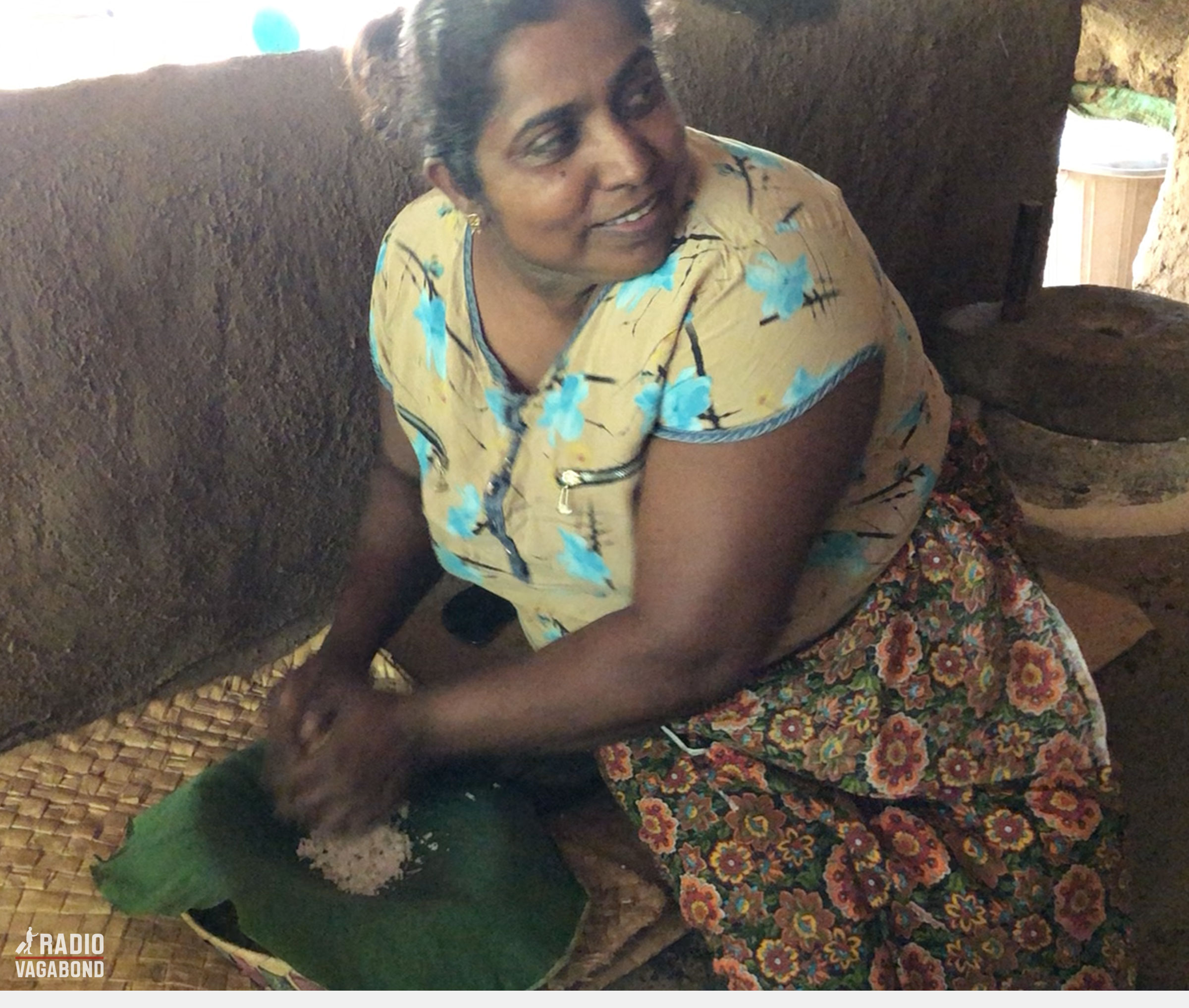 She starts grinding the inside of the coconut. 