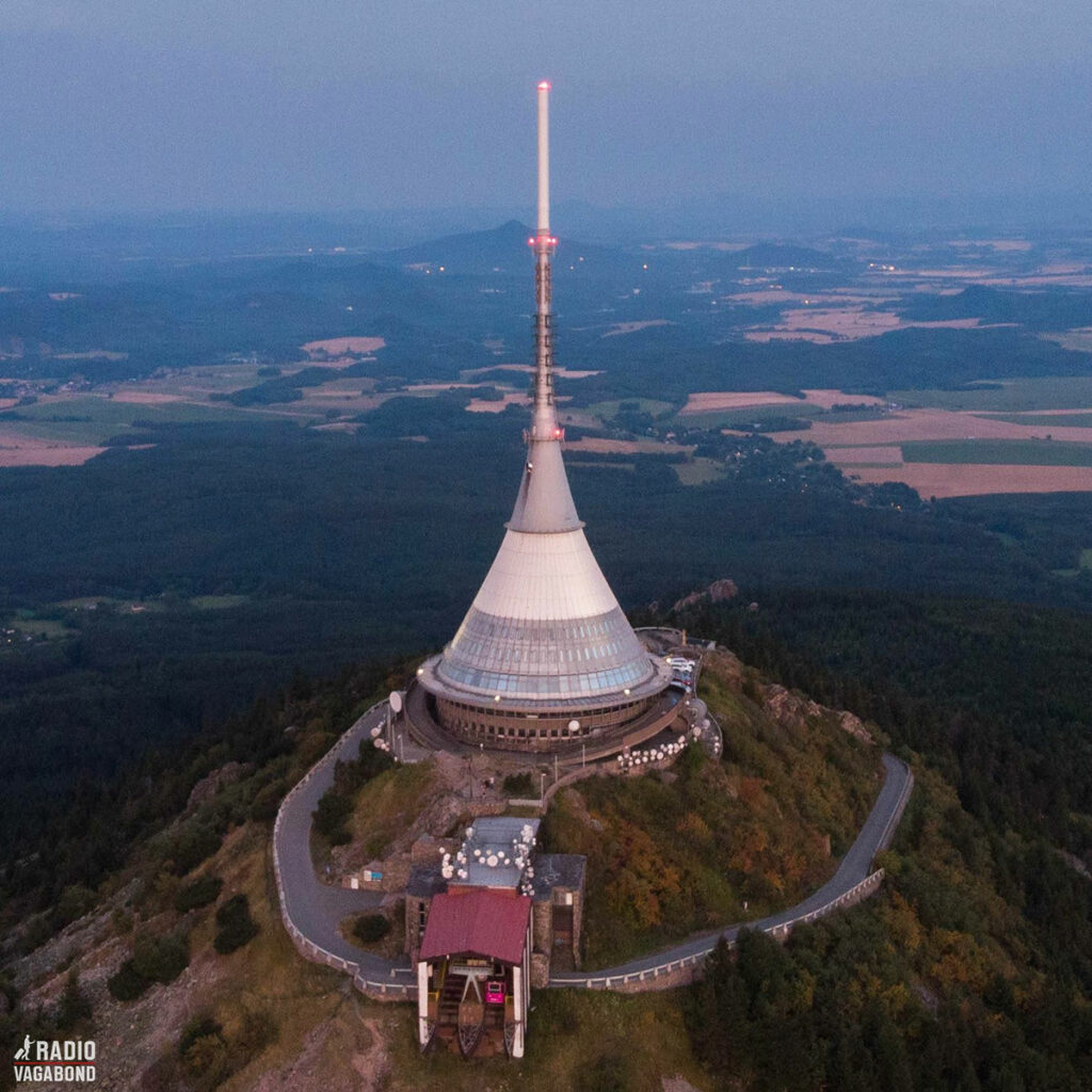The top of Ještěd Hill has a stunning view with a unique building that holds a restaurant, a hotel and a TV tower on the roof.
