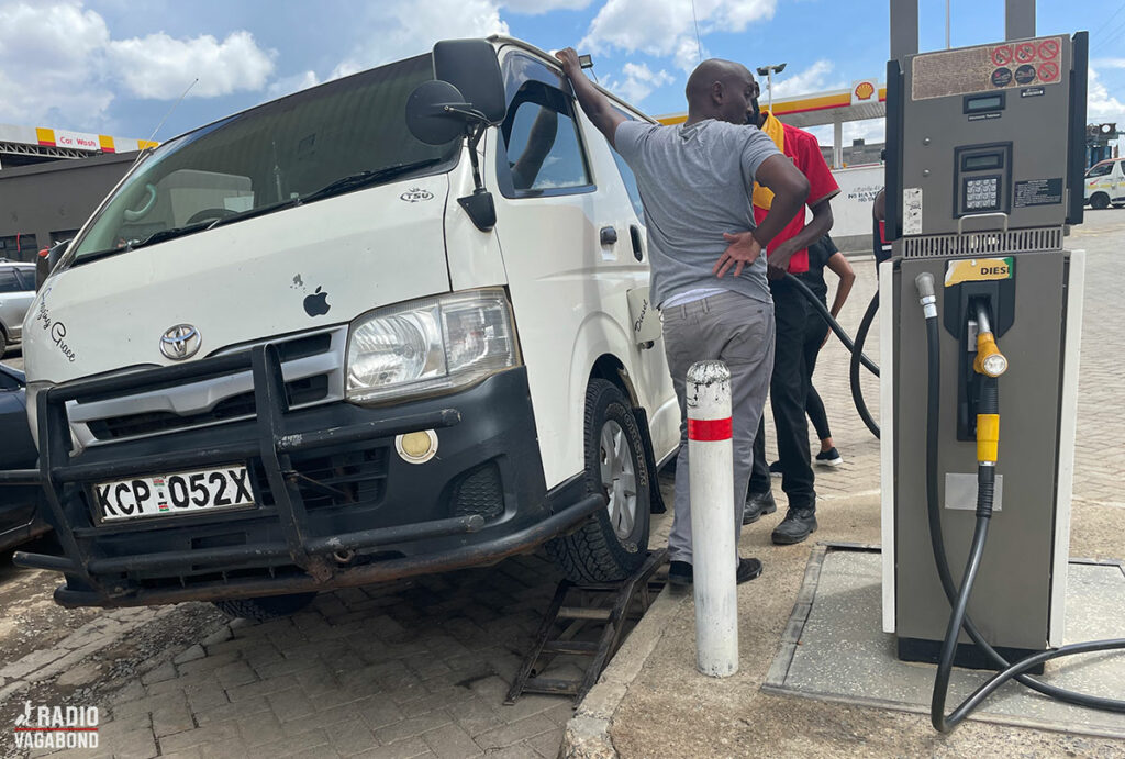 Our driver, Dennis is filling the car with gas – notice how he makes sure that it's REALLY full.