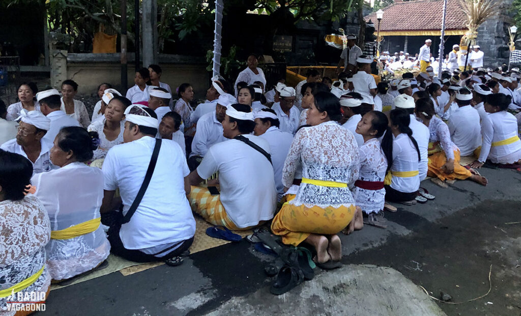 The whole village sit down for dinner in the street